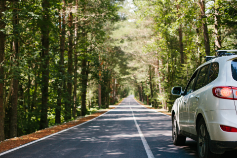car driving down road